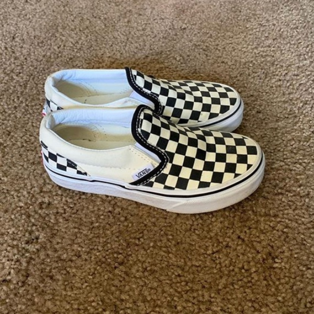 White and black checkered vans.